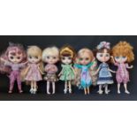 Seven customised dolls in the style of Blythe 'Neo' dolls with colour changing eyes operated by 1 or
