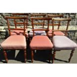 A set of six Victorian mahogany slender curved bar back dining chairs with upholstered seats