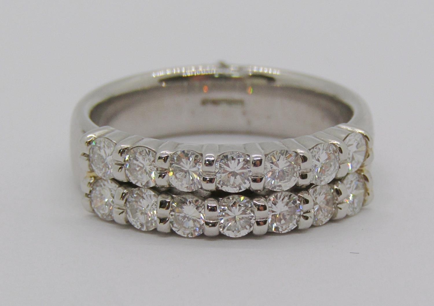 950 platinum double row diamond ring, set with fourteen stones 0.10ct each approx, size O/P, 10.4g