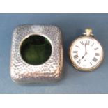 A hammered silver watch case with easel back, monogrammed, London 1903, maker William Comyns & Sons,