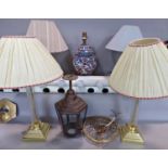 A collection of table lamps, two brass and glass column, a pair of wooden turned, a floral ginger