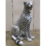 An Italian glazed ceramic ornament in the form of a seated snow leopard, 76 cm high (af)