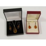Group of silver amber jewellery comprising two pairs of drop earrings and a pendant necklace (5)