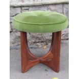 A teak mid-20th century dressing stool, (probably G-Plan) with circular button upholstered seat