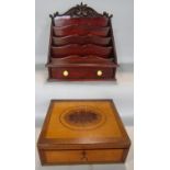 A mahogany desk top stationery rack, 32cm wide, a 19th century mahogany box with intricate inlay.