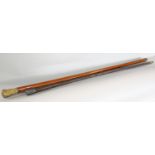 A malacca cane with a gilded scrolled pommel 100cm and a natural wood cane with a silver pommel