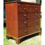 A late Georgian oak chest of three long and two short graduated drawers, crossbanded in walnut,