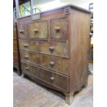 A late Regency period mahogany chest of three long and three short deep drawers, crossbanded in