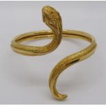 Greek 18ct novelty bangle in the form of a coiled snake, stamped 'Greece 750 A21' to tail, 32.2g
