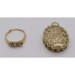 18ct three stone old-cut diamond ring, 2.4g (shank cut) and a Victorian gilt metal locket with