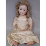 Early 20th century bisque head character doll by the Mengersgereuth Porzellanfabrik company, with