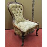 A Victorian drawing room chair with carved and moulded show wood frame, carved floral detail and set