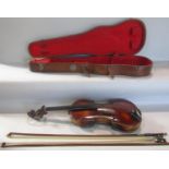 A violin, in need of restoration, with a distressed unreadable label to the interior with a Tourte