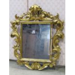 A small Florentine wall mirror with rectangular framed plate and scrolling acanthus surround, 45cm