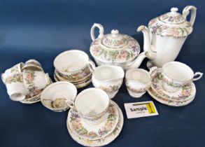 A Paragon Country Lane pattern collection of tea and coffee wares with repeating honeysuckle and