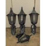 Three painted cast alloy exterior wall lanterns of tapered hexagonal form