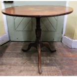 A Georgian oak snap top table, raised on a pillar and tripod, 82cm diameter