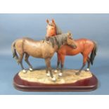 A Leonardo Collection resin figure group of two horses, 41cm long x 29cm tall approx