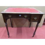An arts and crafts oak writing table with inset leather top, frieze drawer on square tapered legs
