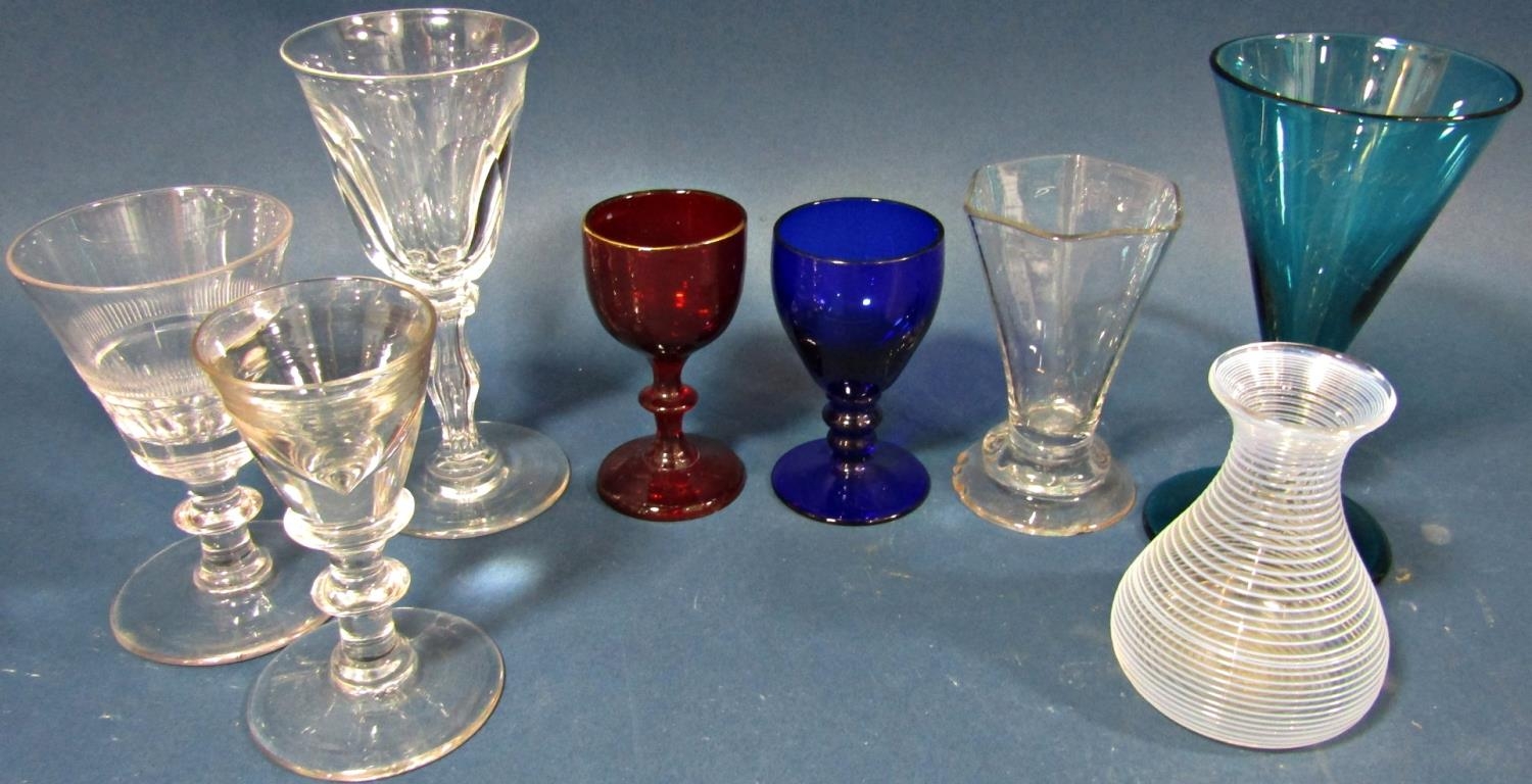 A Georgian facetted baluster wine glass on a facetted stem, a conical shaped wine glass with two