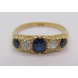 18ct sapphire and diamond five stone ring with scrolled setting, diamonds 0.20ct each approx, size