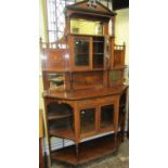 An inlaid Edwardian rosewood chiffonier, the lower section enclosed by an arrangement of cupboards