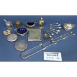 A mixed quantity of silverware consisting of a cigarette case, sugar tongs, salt, pepper and mustard