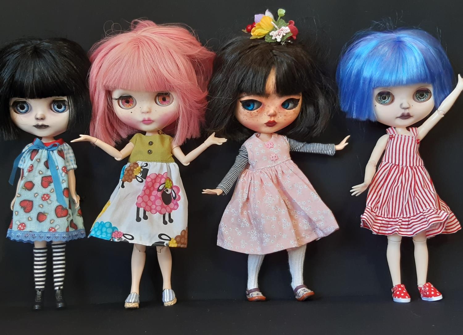 Four dolls in the style of Blythe 'Neo' dolls, customised by 'Blythe Obsession', with colour