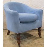 A late Victorian drawing room chair with horseshoe shaped back, light blue upholstered with