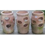 Three weathered terracotta baluster shaped strawberry planters with moulded collars, 36 cm high x 25
