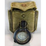 A WWII 1940 MK II T.G.Co Ltd compass in its khaki canvas pouch.