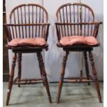 A pair of good quality Windsor style hoop and stick back swivel chair back stools with saddle shaped