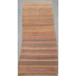 A North West Persian Kurdish Jajim flat weave carpet in horizontal tone of brown 420cm x 95cm approx