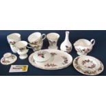 A collection of Wedgwood Hathaway Rose pattern tea wares for six, a pair of Staffordshire spaniels