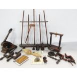 A small collection of treen, including bobbins, miniature clamps, boxes, gong stand, wooden spoon,
