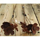 Three small ornamental steel border stakes with floating bee and poppy finials (2&2) together with