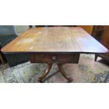 A Victorian Pembroke breakfast table with frieze drawer, drop leaves, turned column and quadruped