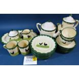 A German pottery tea and coffee service decorated with a black hen/cockerel on cream ground with