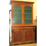 A Victorian oak and mahogany kitchen dresser, the lower section enclosed by a pair of arched