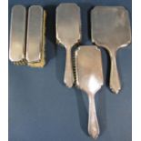 A five piece engine turned silver brush and mirror set