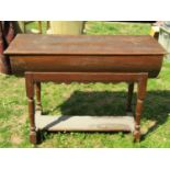 An 18th century oak dough bin with hinged lid, raised/cradled on a stand with turned supports united