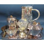 An Art Deco design silver plated four piece Dees tea service with teak handles and tray to match,