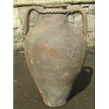 An old terracotta amphora with moulded neck and loop handles, 55 cm high