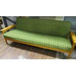A mid-20th century sofa bed with beechwood frame and original woven fabric seat and back
