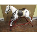 Vintage rocking horse, probably by Triang, with painted finish (partially refurbished) on tubular