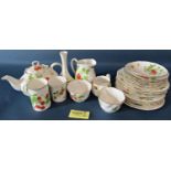 A comprehensive collection of Queens bone china table wares in the Virginia Strawberry pattern