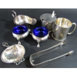 A selection of silver items including two salt cauldrons, a mustard, a tea strainer, a christening