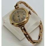Ladies 9ct gold wristwatch with 9ct gold strap, running