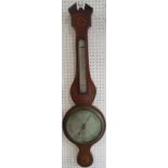 A Georgian mahogany wheel barometer with silvered dials and shell inlaid and floral detail, by J