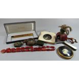 A leather falcon hood, a Watson & Son military compass dated 1908, an agate necklace, etc